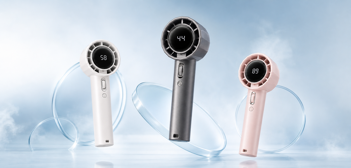 Three PalmGust handheld fans in graphite, pearl and blush